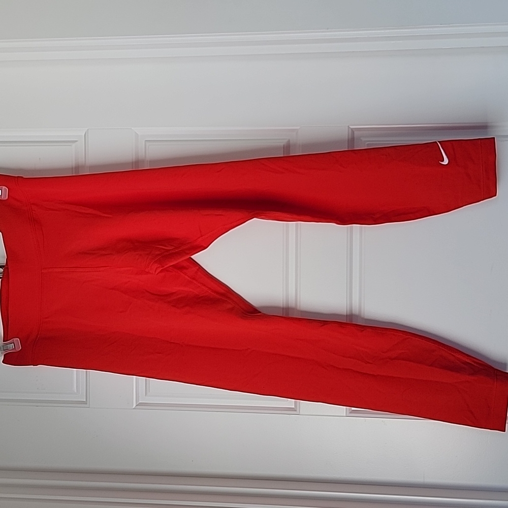 Red Nike workout pants